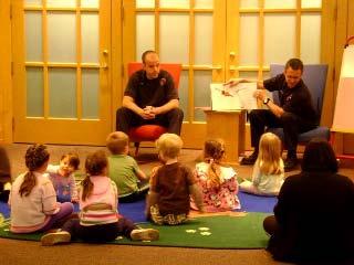FF/PM s Laube (L) and Naffziger (R) read to the children at the Park Ridge Pubic Library on
