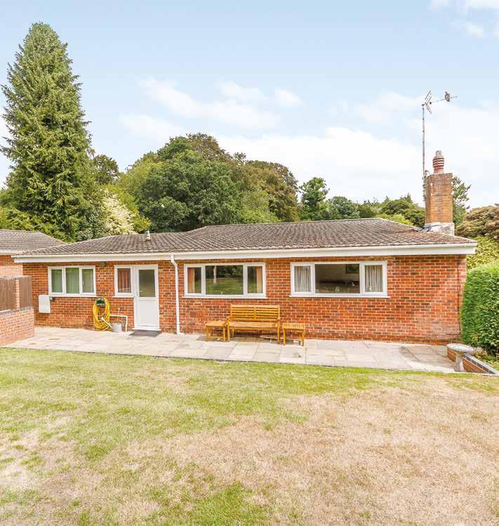 The particularly private grounds of 0.49 acre are enclosed by a well-maintained hedgerow and are approached through double gates on brick pillars with twin lanterns via a block paving style driveway.