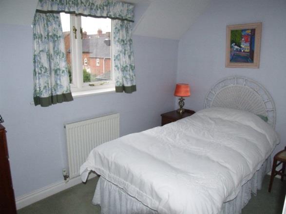 Bedroom 1 Bedroom 2 measuring approximately 10 10 x 7 0 (3.30m x 2.13m) front elevation window, panelled radiator. Built in double fronted wardrobe cupboard with rail and shelf.