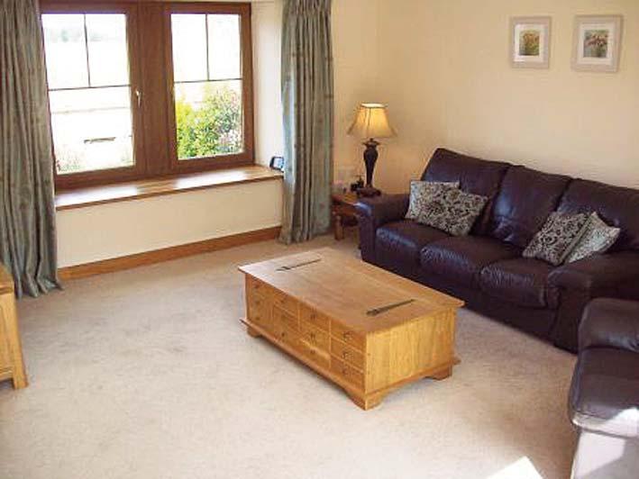 LOUNGE (4.70m x 4.60m) Beautifully positioned room with large double glazed picture window to the rear elevation enjoying views over the River Annan and golf course.