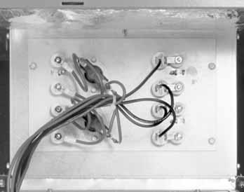 The lowvoltage ( 4 ) and high-voltage ( 5 ) wiring connections are easily accessed and have ample room around which to maneuver.