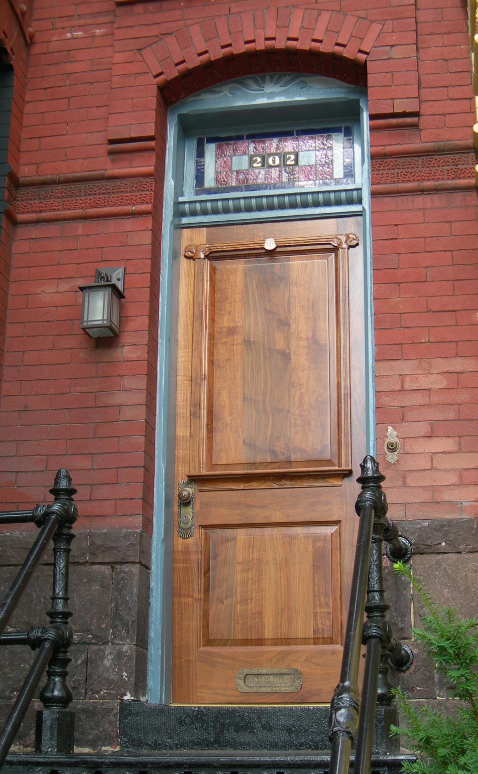 2.4 Precise replication of original door appearance is typically not required if the original door is gone.