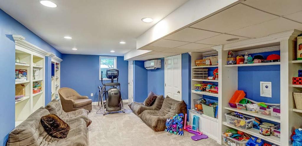 lower Floor New Beautifully Finished Recreation Room: walls of custom built-ins for toy storage, wall-to-wall carpeting, recessed lighting, window to the beautiful backyard lets in great natural