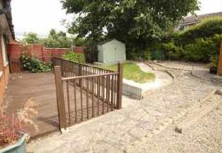To the front of the property the gardens are mainly gravelled and shrubbed with a driveway at the side providing parking for one to two cars. Gates provide access to the rear garden.