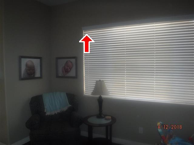 Client is advised to remove the blinds and determine why the blue tape was placed in this location. J. J. L.
