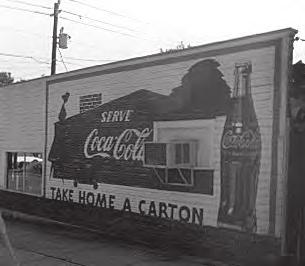 Historic signs like this Coca-Cola wall sign contribute to the district character and should be preserved. 1.