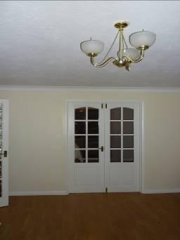 FRENCH DOORS White wooden doors each with 8 fixed lites to top, panel below, brass effect push up locks Handle