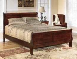 sleigh shaped headboard and footboard Antique bronze color hardware and center metal drawer glides Twin and full beds also
