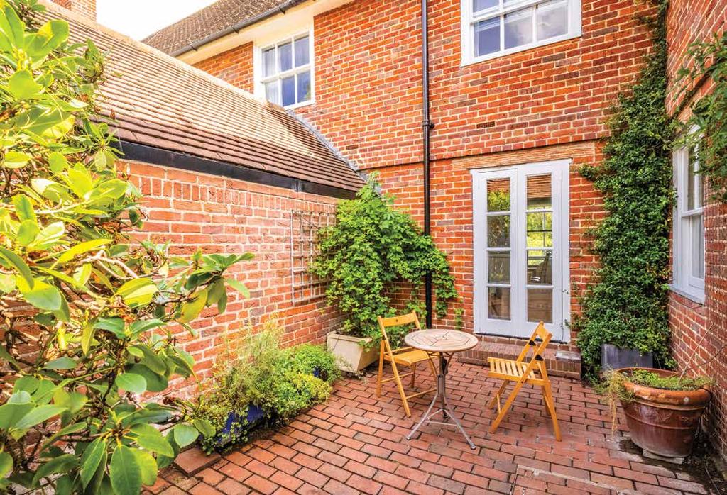A brick paviour pathway leads off the driveway to the front enclosed porch and entrance hall and the delightful front garden, which is laid mainly to lawn with a pretty centrally featured boxed hedge.