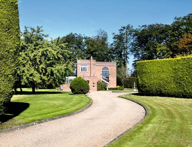 GARDENS: Pinkneys Hall is approached through automatic gates with illuminated coach lamps, a gravel driveway which terminates in a large parking sweep to