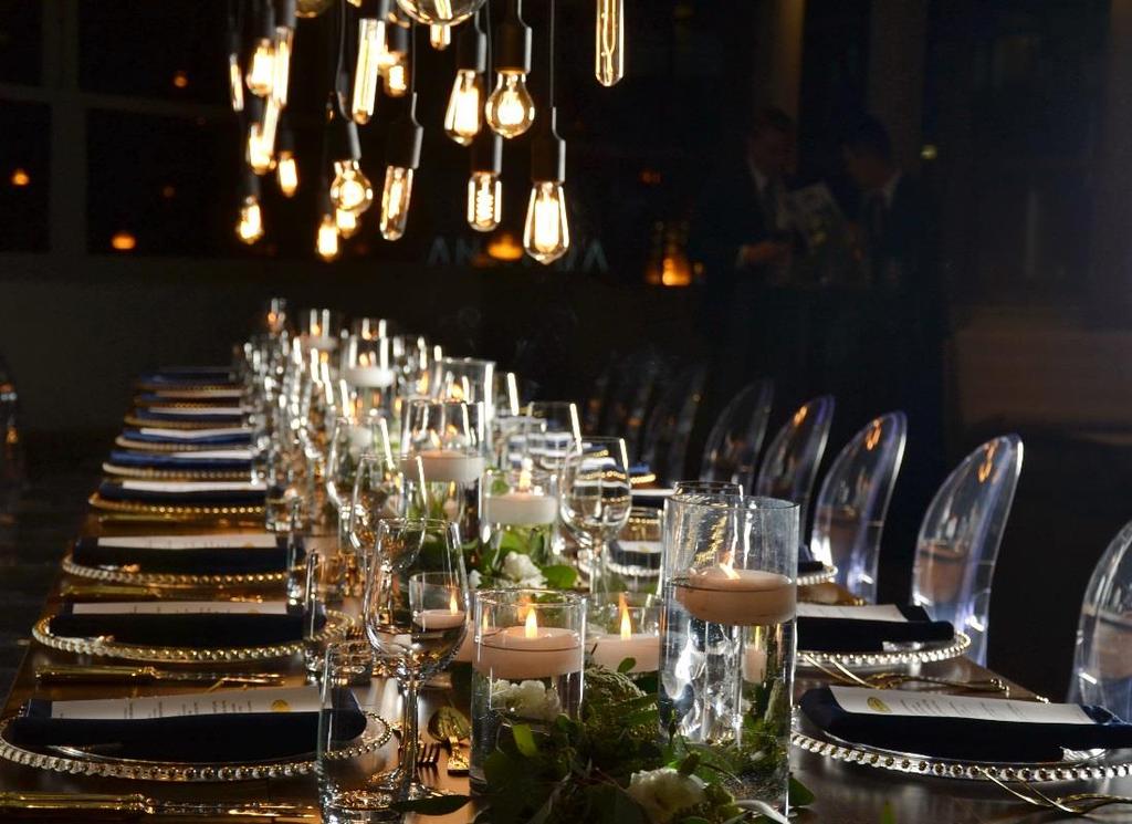 Harvest tables, most often used for rustic style events, added an element of texture and warmth to the space. Three eight foot tables formed the long table.