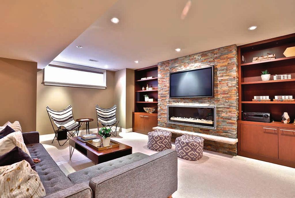 LOWER LEVEL Recreation Room Radiant heated floor Broadloom Fireplace with stone surround flanked with custom built-in shelves and storage Wet bar with built-in cabinetry, Caesarstone countertop and