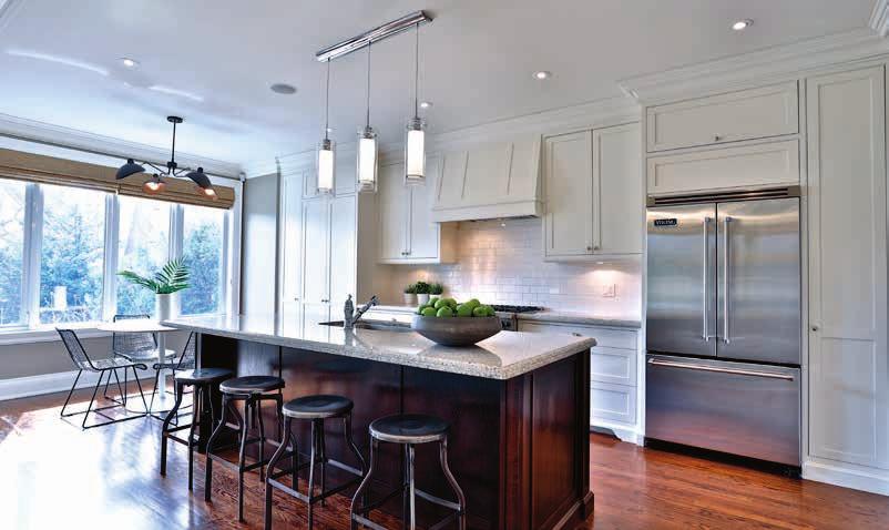 MAIN FLOOR Exceptional Kitchen Abundance of natural light High ceiling Breakfast bar with seating for four Custom built-in cabinetry
