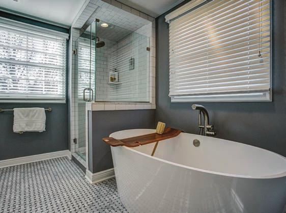 shower with subway tile, 2 mirrored medicine cabinets over over double sinks set in