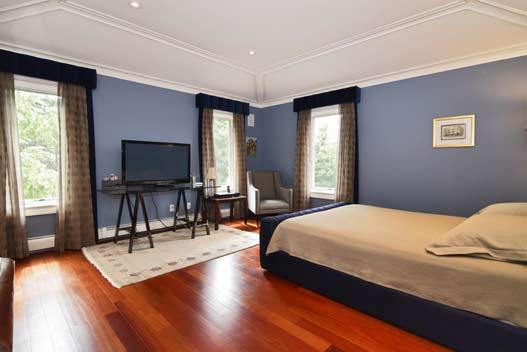 Second Level Bedroom 2: Brazilian cherry hardwood floor, 4 windows with window treatments,