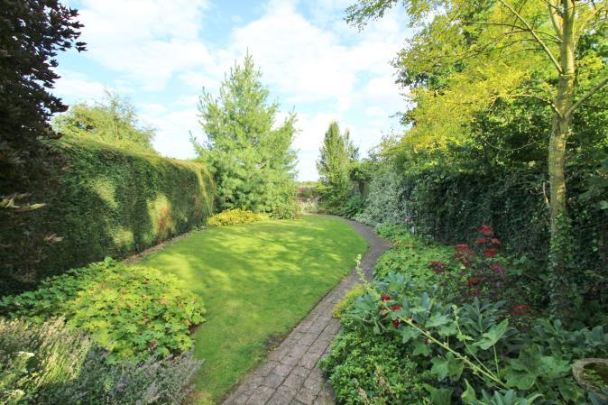 REAR GARDEN The sizeable landscaped garden is mainly laid to