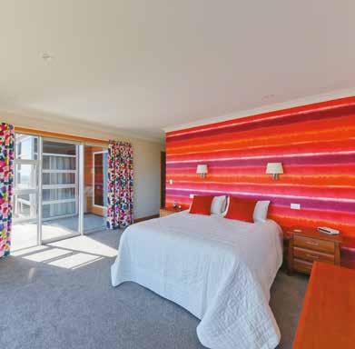 The bedrooms offer up a few surprises, in particular the use of bold colour on the feature walls and curtains.