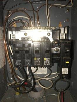 1. Location Materials: Located in the Garage 2 Electrical Panel 2 2. Electrical Panel cover missing, exposing live electrical wires as an electrocution hazard. 3.