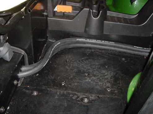 6) 5.8 Using the heater hose cover as a guide, drill through the floorpan with a 5/16 drill bit. Install the heater hose cover to the floorpan using the hardware listed below. (See Figure 5.