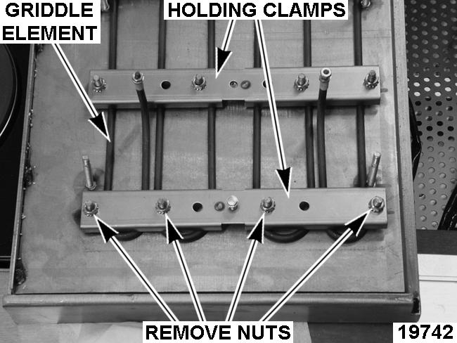 Remove nuts securing griddle base cover. 7. Remove holding clamps. 8. Remove griddle element.