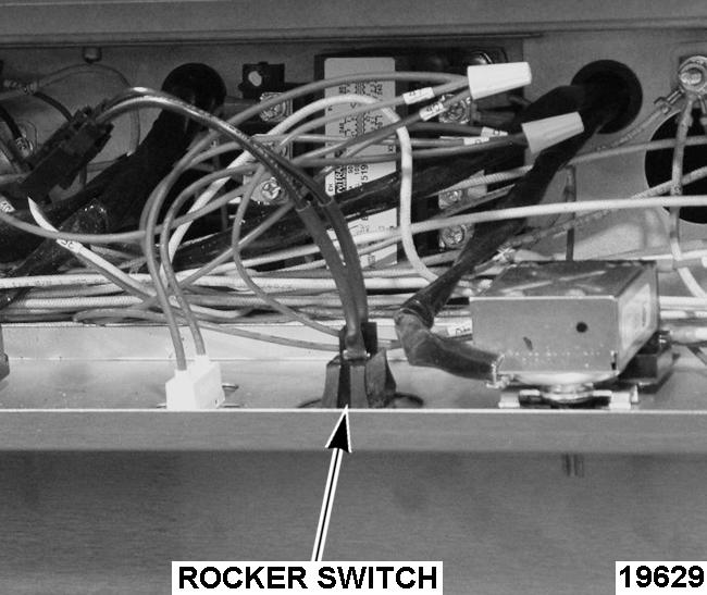 Note wire locations. 3. Squeeze in on the tabs at the ends of the rocker switch and push through the control panel. 4.