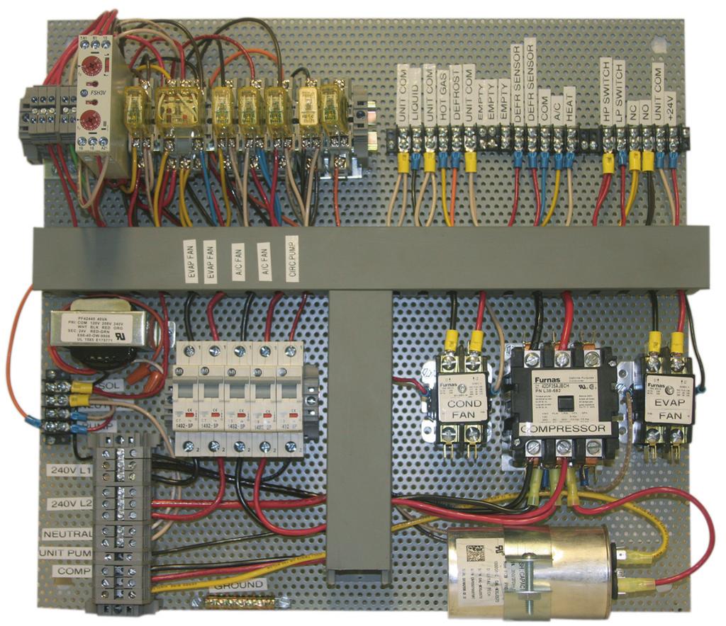 R.A.S.E.R.S System snapshots Electrical panel Hot gas defrost timer Control relays Figure 2: Electrical panel components Low-voltage terminal block (between tank thermostatic controller, house