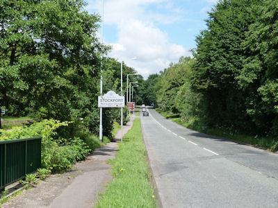 Arrival into Woodford along Wilmslow Road The border with Cheshire East on Wilmlsow Road Land use Area 9 is almost