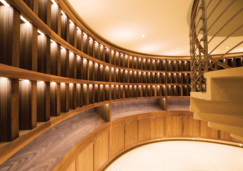 Bespoke circular wine cellar in both solid timber and veneers with
