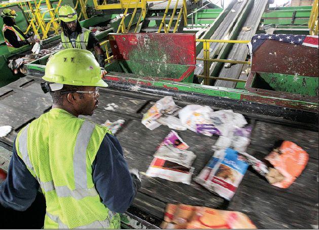 Junk thrown in with recycling Initiative aims to teach public of prohibited items dangers EMILY WALKENHORST ARKANSAS DEMOCRAT-GAZETTE Arkansas Democrat-Gazette/BENJAMIN KRAIN Workers at Recycle