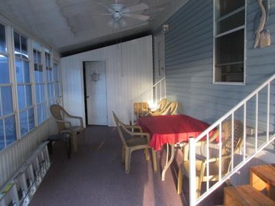 INCLUDED SECURITY STORAGE SHED, LARGE LOT WITH CEMENT PATIO AND PARKING AREA.