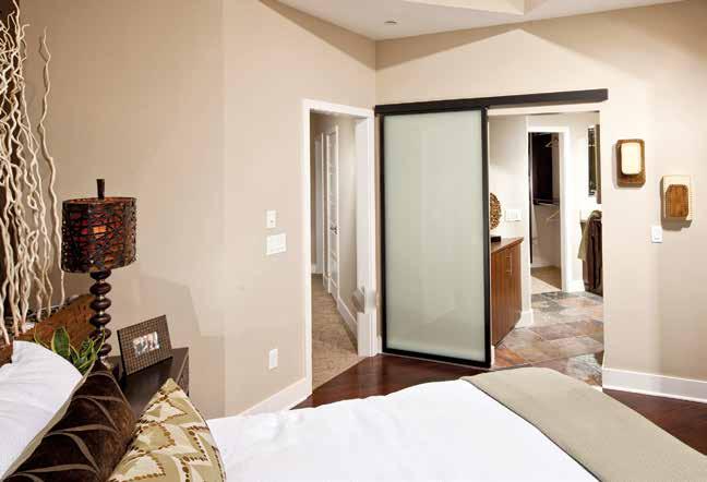 The DIVIDERS SLIDING PASSAGE DOOR is a system that can be mounted to a surface of a wall with no floor tracks required.