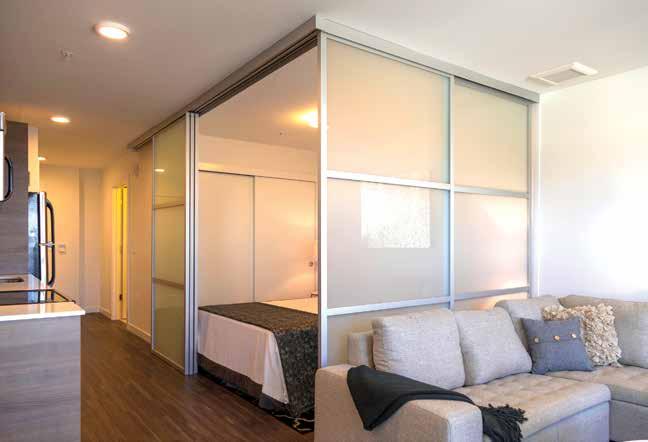 The DIVIDERS TOP HUNG ROOM DIVIDER is a system that can be mounted under a header, mounted to a ceiling or mounted using the DIVIDERS Aluminum Beam System.