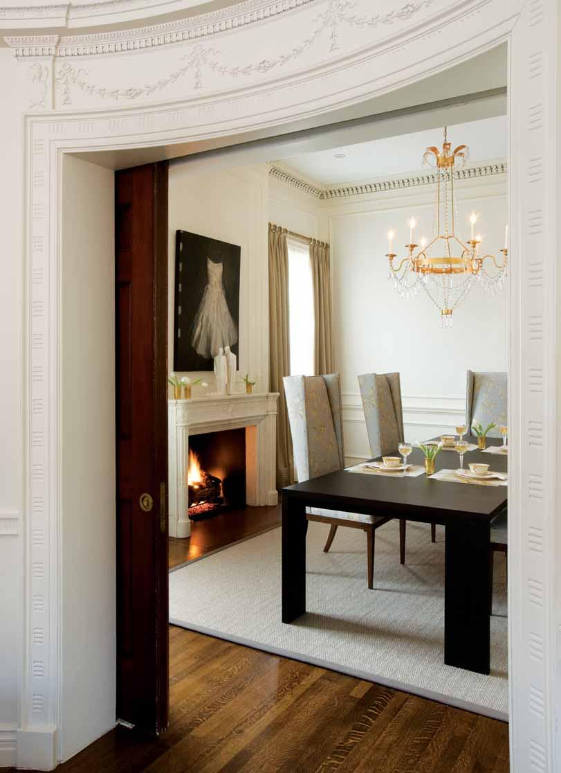 Curved pocket doors original to the 1890s home separate the family and dining rooms.