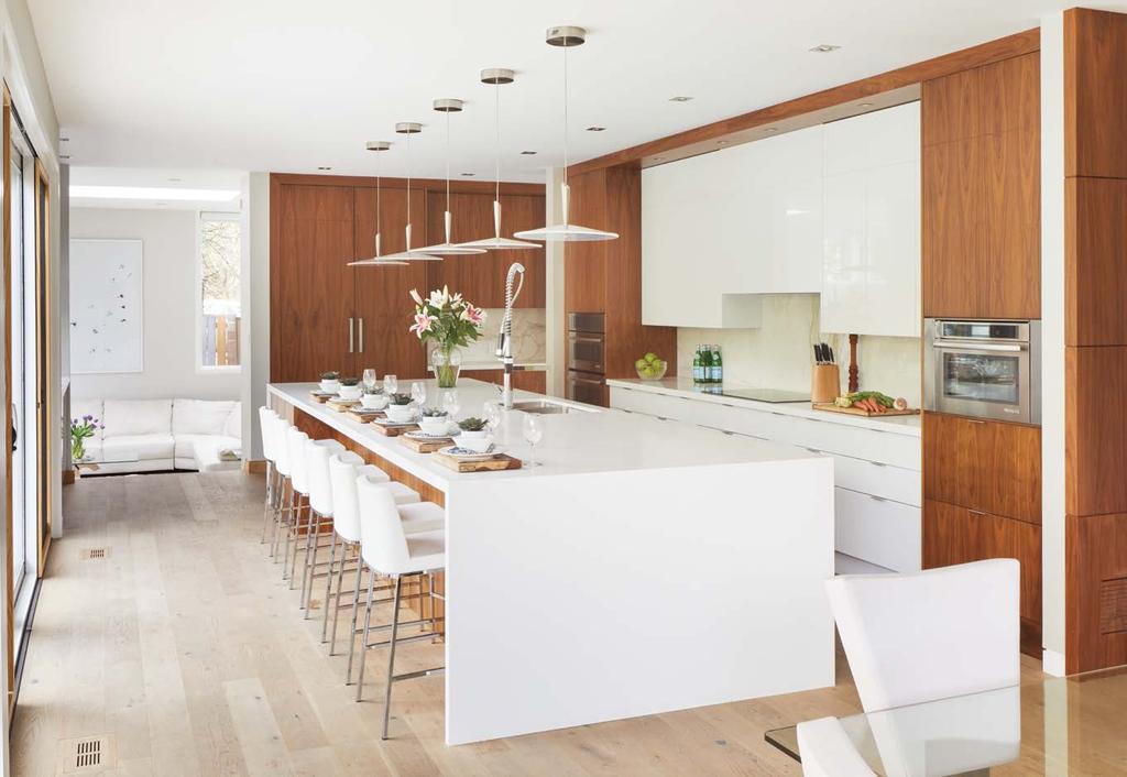 The 19-foot island encompasses the entire kitchen space and serves as a multipurpose area.