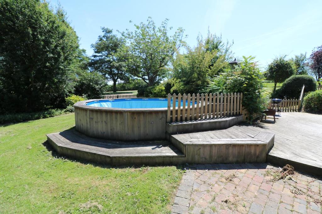 Garden / Grounds Garden predominantly situated to the south of the main house, the garden has an enclosure of lawn and circular framed swimming pool, terraced decking and BBQ area.