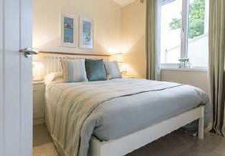 Master Bedroom Spacious room with a king-sized bed, built-in cupboards and wardrobe, window to the