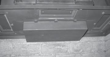 To set the vent restriction as indicated in the venting arrangements diagrams, refer to the following instructions; a. Release the 2 door latches on the left and right side at the top of the firebox.