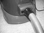 And must be stored in a dry location. 1. Attach paper bag to tank inlet deflector. See Figure 1. 2. Ensure that the cartridge filter is securely attached to the bottom of the vacuum head.