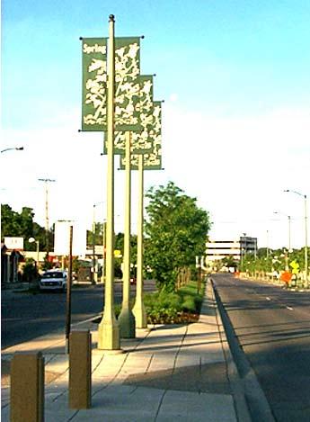 Louis Park has landscaped medians with refuges for pedestrians who cross the wide road.