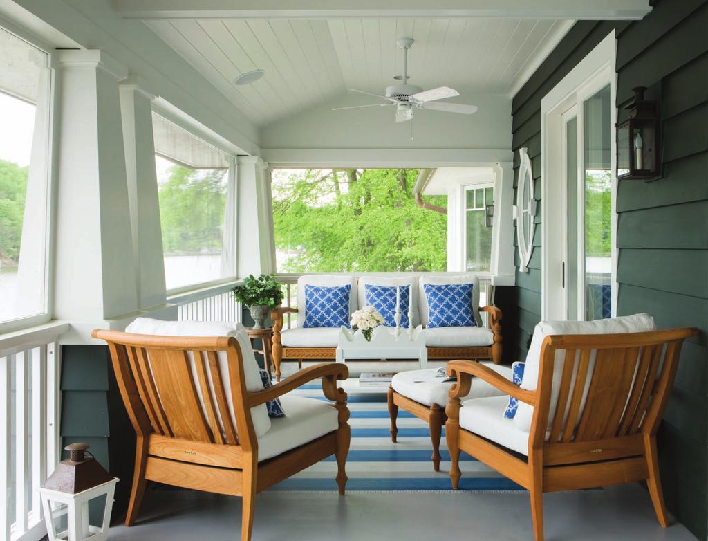 A large front porch is screened for three season comfort and offers incredible views of the Severn River.