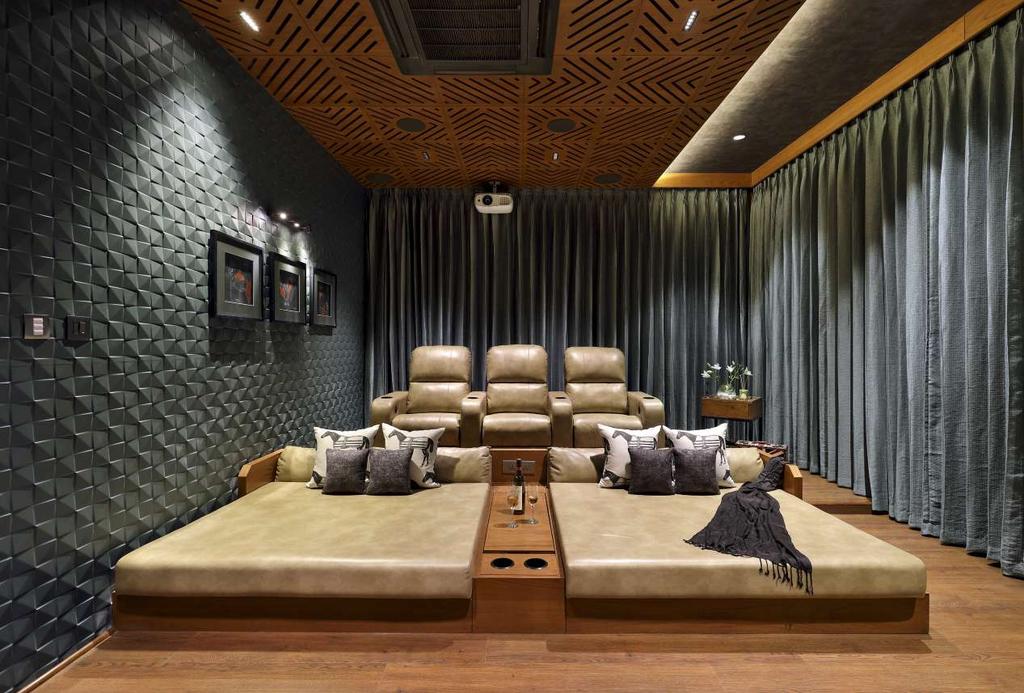 13 45 BRICK HOUSE > A+T ASSOCIATES, VADODARA Above: Home Theatre on First Floor The master bedroom is designed to complement the exterior look of the house as it is situated in the front box shell.