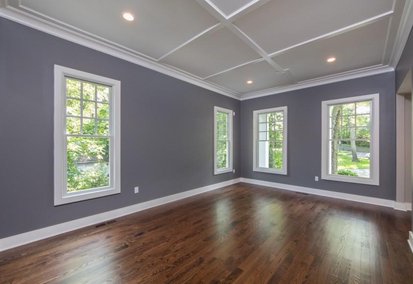 To the right you ll find the spacious bedroom with a tray ceiling and large picture window overlooking the backyard.