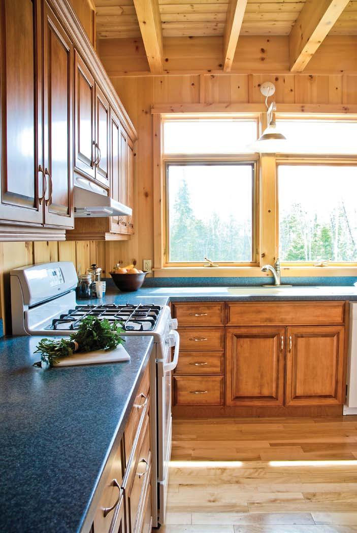 home & builder LEFT: The L-shaped kitchen provides an efficient workspace for meal preparation.